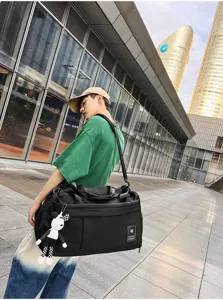Large capacity travel duffel bag for sports, gym, and weekend trips with sturdy handles.