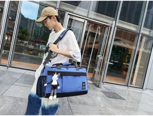 Large capacity travel duffel bag for sports, fitness, and short trips with storage pockets.