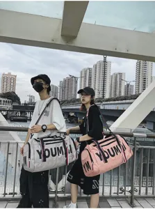 Large capacity travel duffel bag outdoor street scene detail showing durable fabric and straps.