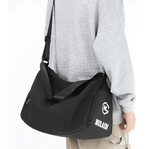 Large capacity black gym duffel bag for fitness, swimming, and travel. Waterproof sports shoulder bag.
