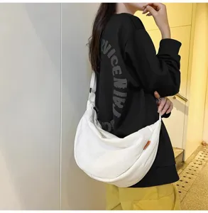 Large capacity white crescent dumpling crossbody bag for casual daily use, lightweight travel.