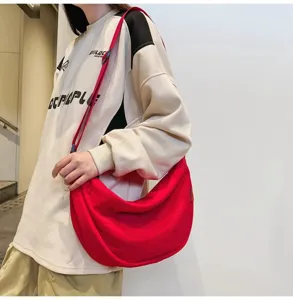 Casual red canvas crossbody bag for women and men, large capacity daily shoulder bag.