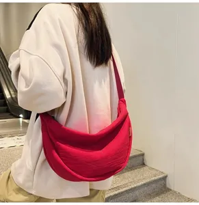 Large capacity red dumpling crossbody bag for women and men, casual daily canvas shoulder bag.
