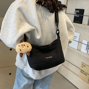 Vintage casual canvas crossbody bag for women, stylish everyday shoulder messenger bag.