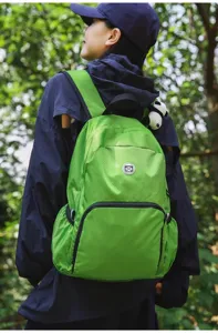 Lightweight waterproof green outdoor backpack large capacity travel daypack for men and women.