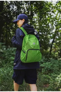 Outdoor green casual backpack detail view showing material texture and strap design.