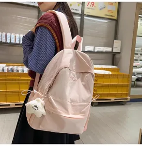 Lightweight casual solid color backpack for women, stylish school bookbag for students daily use.