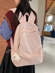 Casual pink minimalist backpack for students, lightweight daily school book bag and daypack.