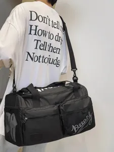 Large capacity black travel duffel bag with shoulder strap, perfect for fitness and sports.