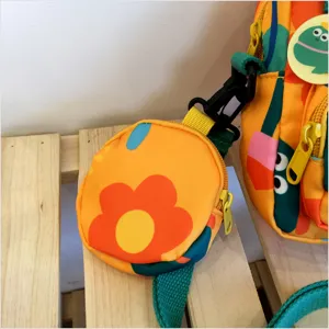 Canvas crossbody bag with coin purse, cute cartoon frog design, vibrant orange aesthetic.
