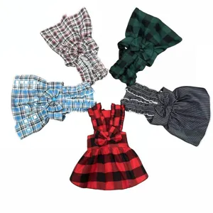 Cute plaid pet dress set for dogs and cats, featuring bowknot design and comfortable fabric.