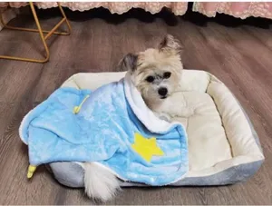 Detail view of the cozy winter pet cloak blanket with cute star design for small dogs cats.