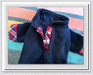 Detailed view of the thick warm pet hoodie featuring cozy plush fabric and stylish plaid cuffs.