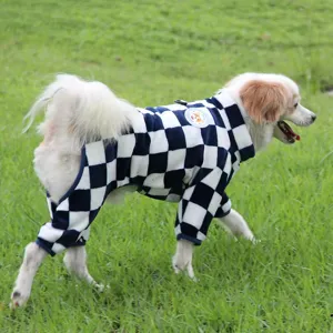Detail shot of the cozy fleece pet jumpsuit in blue and white check, worn by a running dog.