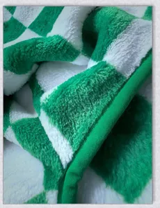 Green and white checkerboard plush fabric detail for warm pet clothes, soft winter fleece.