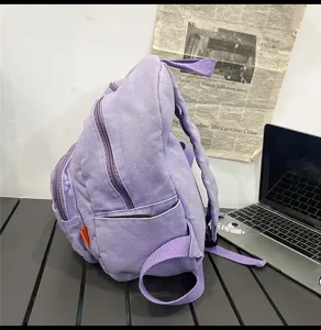 Purple canvas backpack for women, casual vintage school bag, solid color daypack.