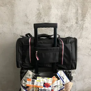 Large capacity black travel duffel bag with luggage sleeve for short trips and fitness.