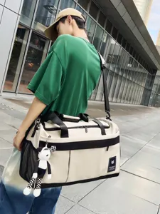 Large capacity travel duffle bag for men, waterproof sports gym bag for weekend trips.