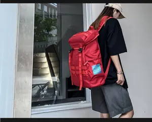 Stylish red canvas casual backpack detail view, perfect for daily commute and outdoor activities.
