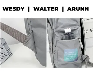 Gray casual backpack detail showing reinforced shoulder strap and side pocket design.