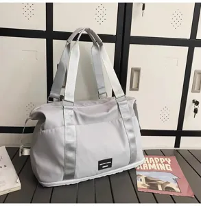 Light gray travel duffel bag for women, large capacity gym sports bag, lightweight weekend luggage.