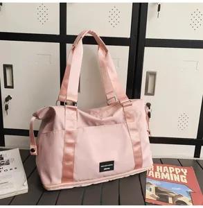 Pink travel duffel bag for women, large capacity gym bag, lightweight weekend luggage.