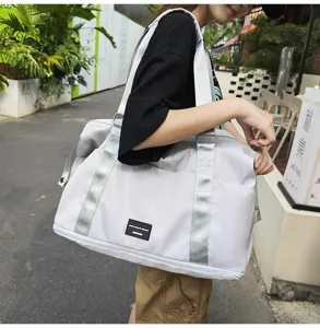 Lightweight travel duffel bag for women, large capacity expandable gym and luggage weekender.