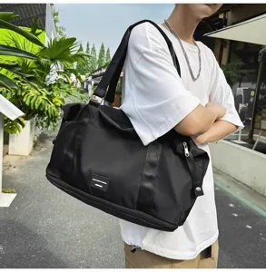 Large capacity black travel duffel bag, waterproof sports fitness bag with shoes compartment.
