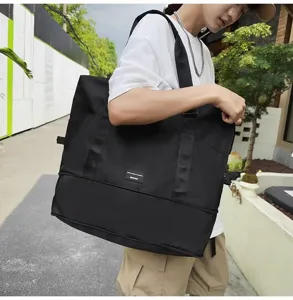 Large capacity expandable travel duffel bag in black, lightweight and durable for gym or business trips.