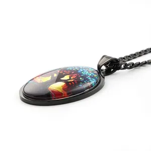Detailed close-up of a stunning black metal tree of life time gem glass pendant necklace.