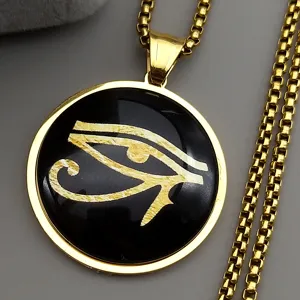 Close-up detail of the vintage gold Eye of Horus pendant necklace, elegant metallic texture.