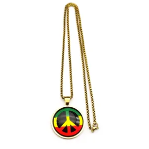 Peace sign pendant necklace with gold box chain and vintage colored glass cabochon.