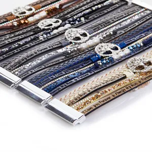 Bohemian leather wrap bracelet for women with rhinestone tree of life charm and magnetic clasp.
