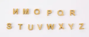 Gold metal letter charms detail view, DIY alphabet pendant accessories for bracelets and necklaces