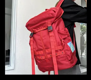 Red large capacity canvas backpack with durable straps and multi-functional daily use design.