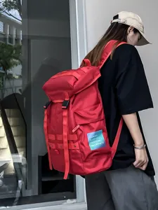 Large capacity workwear backpack for outdoor travel, durable fabric, stylish red daily daypack.