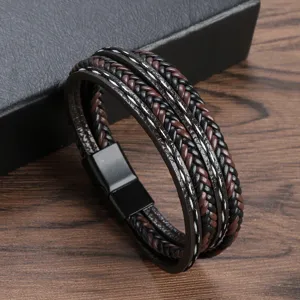 Multi-layer braided leather bracelet with stylish black and brown design and magnetic clasp.