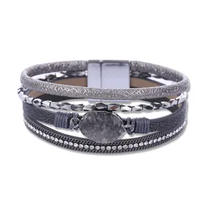 Detailed view of bohemian multi-layer grey leather rhinestone bracelet with magnetic clasp.