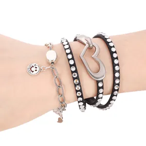 Women's multi-layer rhinestone leather wrap bracelet with cute heart charm and metal chain.