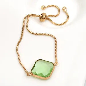 Elegant adjustable gold plated box chain bracelet featuring a square light green crystal pendant.
