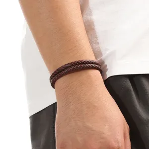 Close-up of men's double layer braided leather bracelet in vintage brown casual style.