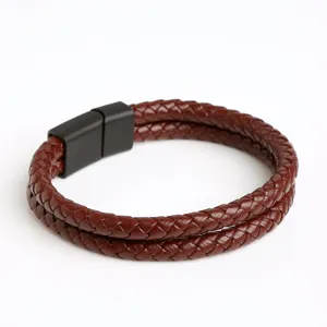 Close-up of the double-layer brown braided leather bracelet with black magnetic clasp.