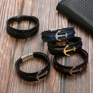 Detailed view of multi-layer braided leather bracelets with metal anchor charms and clasps.