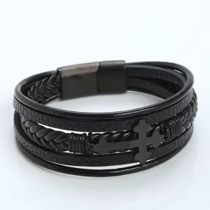 Black leather braided bracelet detail view featuring stainless steel cross charm and secure clasp.