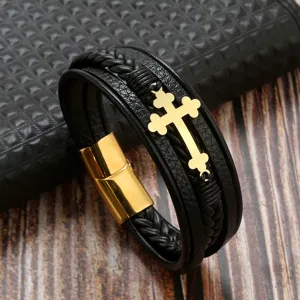Detailed close-up view of men leather braided bracelet with gold cross and magnetic clasp.