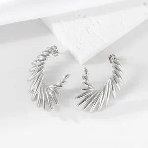 Minimalist silver wing hoop earrings, unique stainless steel geometric jewelry for women.