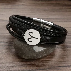 Men's multi-layer braided leather bracelet with stainless steel zodiac charm and magnetic clasp.