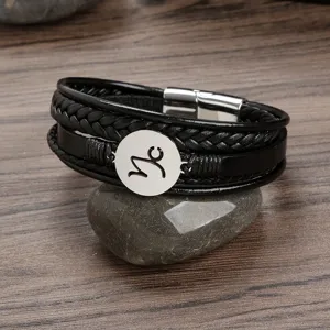 Mens black leather braided multilayer bracelet with stainless steel zodiac sign charm.