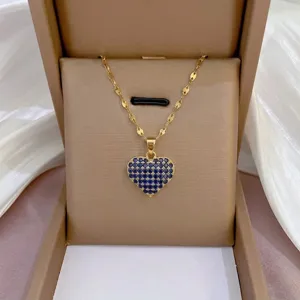 Elegant gold-plated heart necklace with blue pavé zirconia stones, stylish clavicle chain.