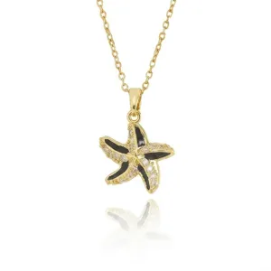 Detailed view of the exquisite gold starfish necklace featuring sparkling zirconia and black enamel.